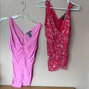 A light pink and a hot pink floral blouses.